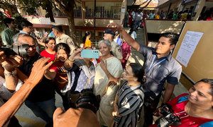 Voting for 14 LS seats underway in K’taka; Rahul Dravid, FM Nirmala Sitharaman among early voters