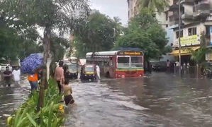 Heavy rain brings Mumbai to halt, road & rail traffic hit, schools shut