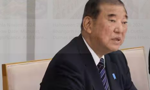 Japan’s ruling coalition loses majority in lower house 