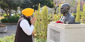 CM BEGINS HIS JAPAN TOUR, PAYS FLORAL TRIBUTE TO MAHATMA GANDHI AT EDOGAWA GANDHI PARK